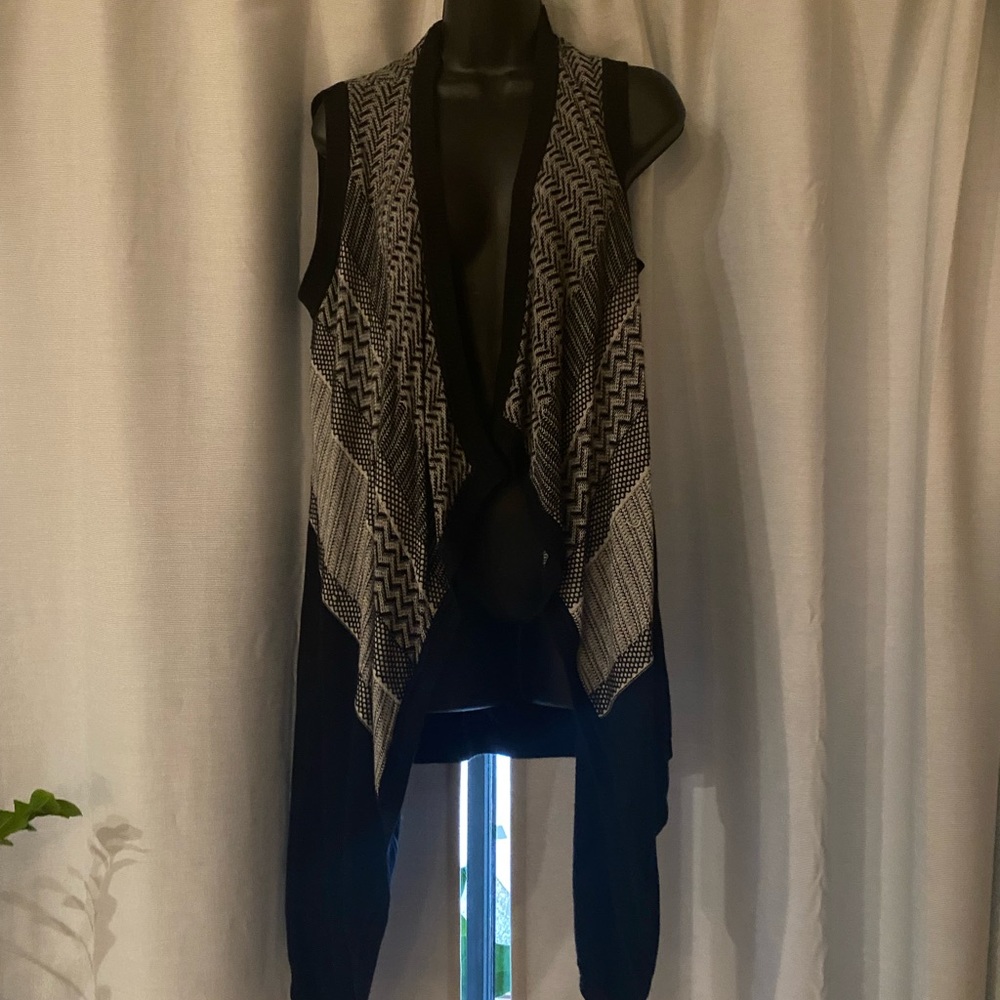 White, black and gray cardigan